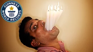 Most lit candles in the mouth - Guinness World Records