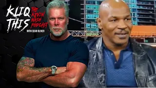 Kevin Nash watches Mike Tyson cursing during an interview