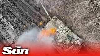 Russian tanks explode as Ukrainian drones drop bombs into open hatches