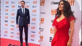 Alexander Skarsgard and Salma Hayek walk TIFF red carpet