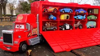 Find a Disney Cars miniature car and put it on the trailer