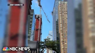 WATCH: Crane catches fire in NYC and plummets onto Midtown street