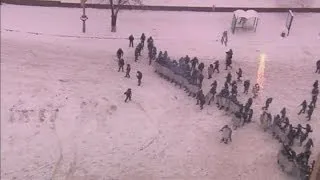 Ukraine clashes: Snow falls on protesters as grenades are thrown