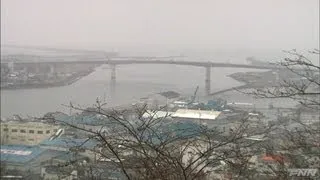 石巻市に押し寄せる津波