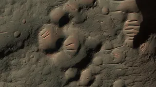 Mars: Light Toned Material on Crater Floor in Tyrrhena Terra