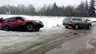 Škoda Octavia Scout towing Subaru Forester out of the ditch