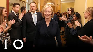 Prime Minister Liz Truss is clapped in to 10 Downing Street