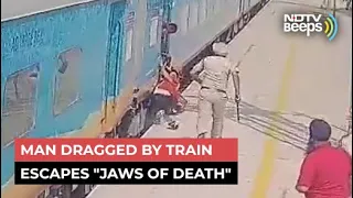 Watch: Man Dragged By Train Escapes "Jaws Of Death"