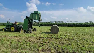 1964 John Deere Powershift baling hay with a 435 Round Baler