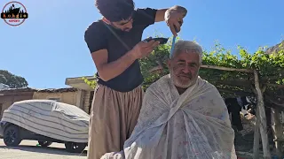 Nomadic life: Shaving the father's hair