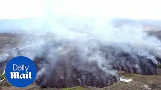 La Palma volcano: Drone footage shows lava flows engulfing houses as volcano erupts