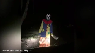 Terrifying moment clown carrying a machete approaches car