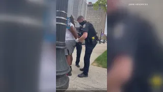 RAW: Video appears to show Louisville police officer repeatedly punching man during arrest