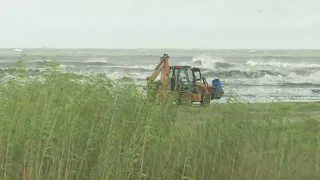 Heavy machinery helping shore up the levee system on Grand Isle