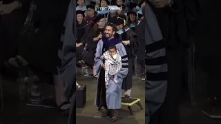 Teachers College graduate brings keffiyeh wrapped baby to graduation