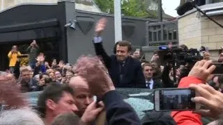 France candidate Macron leaves home to vote