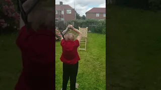 76 year old woman axe throwing.