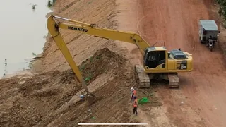 A long hand excavator digging to clean river before raining season