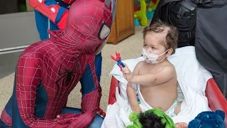 Superhero window washers brighten a long stay in the hospital