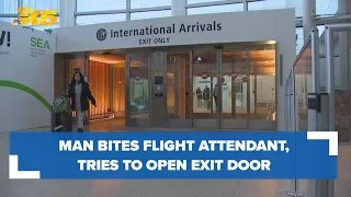 Man bites flight attendant, tries to open plane's exit door on flight to Seattle