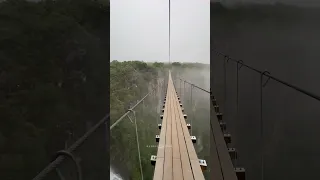 Influencer crosses bridge into clouds above 2,500ft tall waterfall