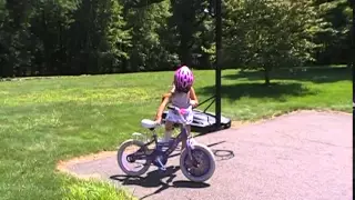 Sasha learning to ride a bike