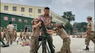 China teaching elementary school children how to use mortars