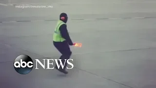 Airline worker's dance moves bring smiles and goes viral