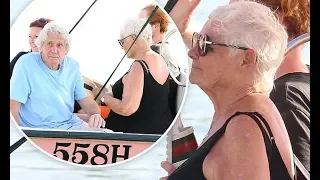 Judi Dench, 85, looks relaxed as she soaks up the sun with partner David Mills, 76, and daughter Fin