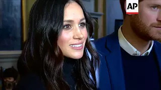 Harry and Meghan meet schoolchildren at Scottish Parliament