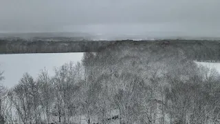 4k HI RES DRONE VIDEO - FREE STOCK - Fresh Snow Forest overlooking landscape horizon