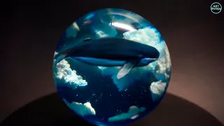 Whale in epoxy resin clouds. Resin art sphere. Epoxy resin. 3D Resin Art.