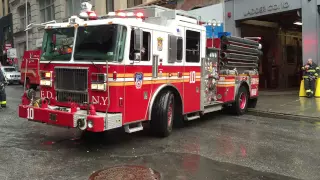 FDNY LADDER 10 & FDNY ENGINE 10 RETURNING TO QUARTERS ON LIBERTY ST. IN WALL ST. AREA OF MANHATTAN.