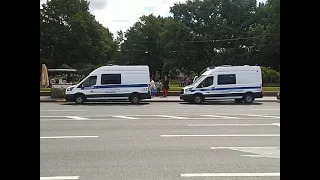 Russian traffic police cars and police station vans with flashing lights