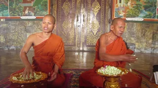 Buddhist monks chant blessing at monastery in Oudong, Cambodia