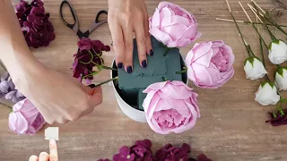 Creating a composition with soapy flowers: roses, peonies, hydrangeas and chrysanthemums.
