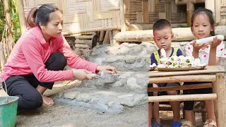 The girl builds a house foundation to resist rain and floods | cooks with two grandchildren.