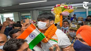 Rousing welcome to Olympic gold medallist Neeraj Chopra at Delhi airport