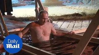 Vladimir Putin braves ice-cold water for Epiphany celebration - Daily Mail