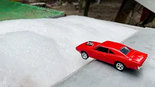 white soap foam erases me for a diecast model car to fall into the water