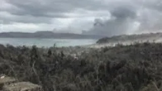 Philippines volcano evacuees collect belongings