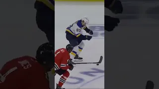 Jake Neighbours dribbles puck down ice