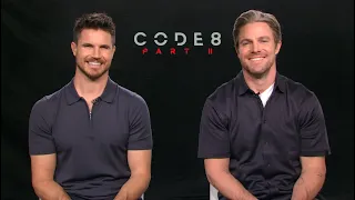 CODE 8: PART II Interview! Robbie Amell & Stephen Amell talk growing up together, HEELS! Netflix