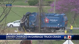 Driver charged in garbage truck crash
