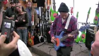 Flea playing a Fleabass at Schmitt Music