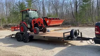 Loading the LX2610 onto a 20 foot dovetail equipment trailer. ￼