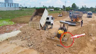 Great Good job operator Komatsu Bulldozer Pushing Soil And Dump Truck 5 ton Pushing Dirt