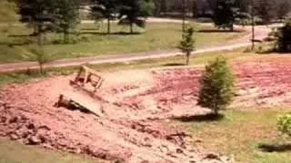 Time lapse of bulldozer making pond