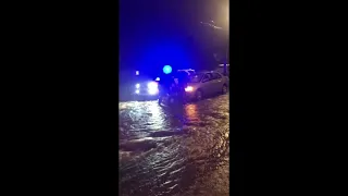 Hawaii residents wade through flooded streets