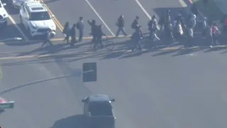 Police chase suspect waits for kids to cross street near Lakewood
